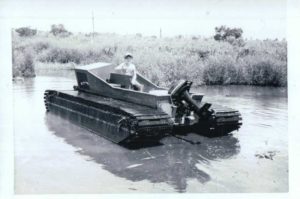 Child sitting in old model of Marsh Master<sup>®</sup>