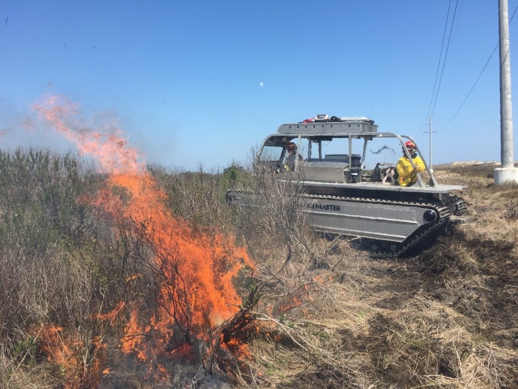 A Marsh Master® MM-2 using a high-volume water pump to fight a fire.